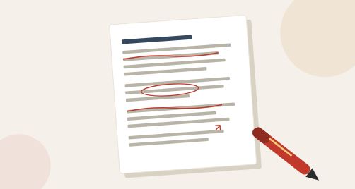 Red pen editing marks on a printed essay