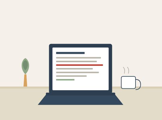 A writer editing a document on a laptop